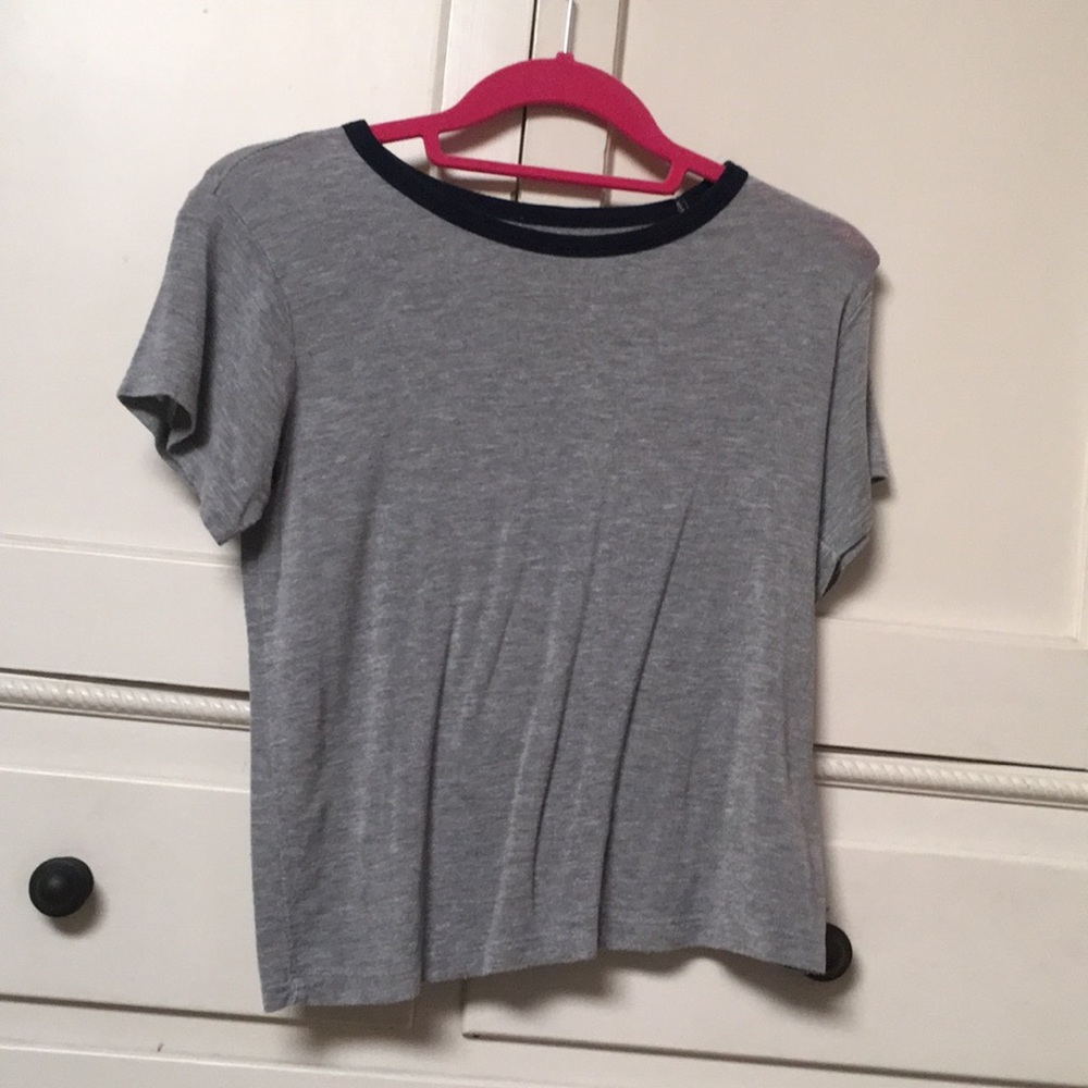 Brandy Melville basic grey t-shirt with blue trim.